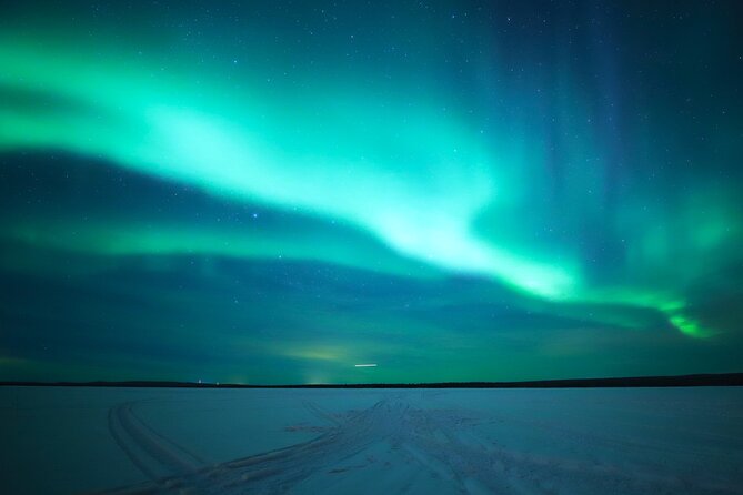 Chasing Aurora with Photographer - Small Group - Warm Up at the Open Fire: Lappish Sausages and Hot Drinks