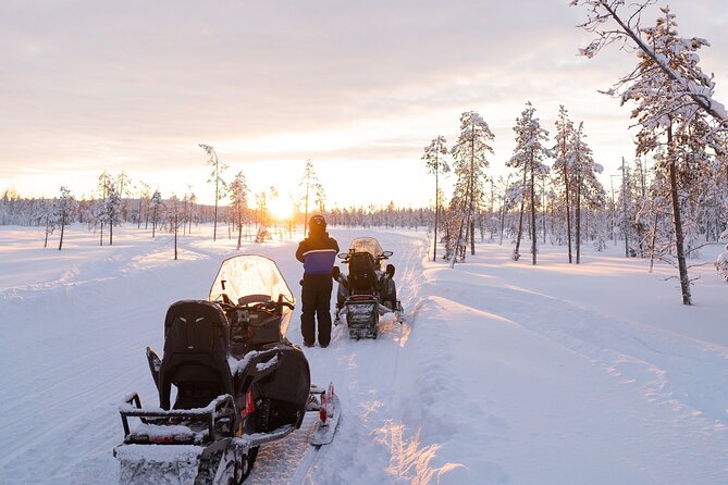 Evening Snowmobile Safari in Rovaniemi - The shared snowmobile setup: passengers, drivers, and how kids ride