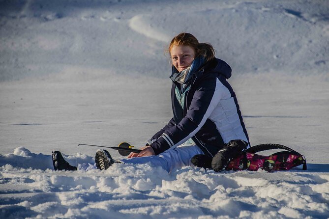 First Ice Fishing Experience in Rovaniemi - Learning the basics: drilling the hole and getting fish-ready