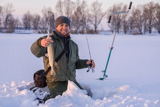 Lapland Ice Fishing Experience from Rovaniemi - Drilling Through Thick Ice: The Moment Everyone Remembers
