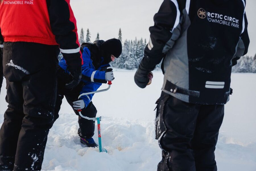 Rovaniemi: Arctic Circle Ice Fishing Experience - Campfire on the frozen lake: hot juice and sausages