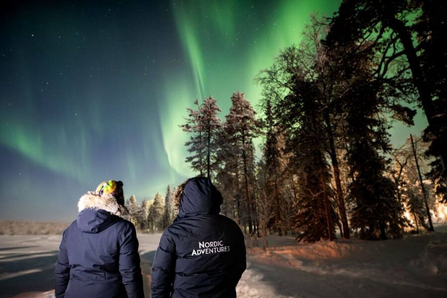 Rovaniemi: Arctic Ice Floating and Northern Lights Tour - Warming Up by the Open Fire With Cookies and Hot Berry Juice