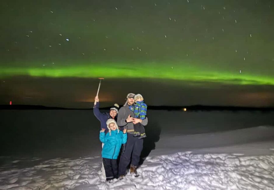 Rovaniemi: Aurora hunting and a fireside BBQ experience - Pickup, minivan ride, and leaving the city glow