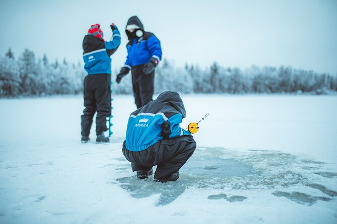Snowmobiling and ice fishing in Apukka Resort, Rovaniemi - Bonfire warm-up: tea, coffee, and the moment the cold eases